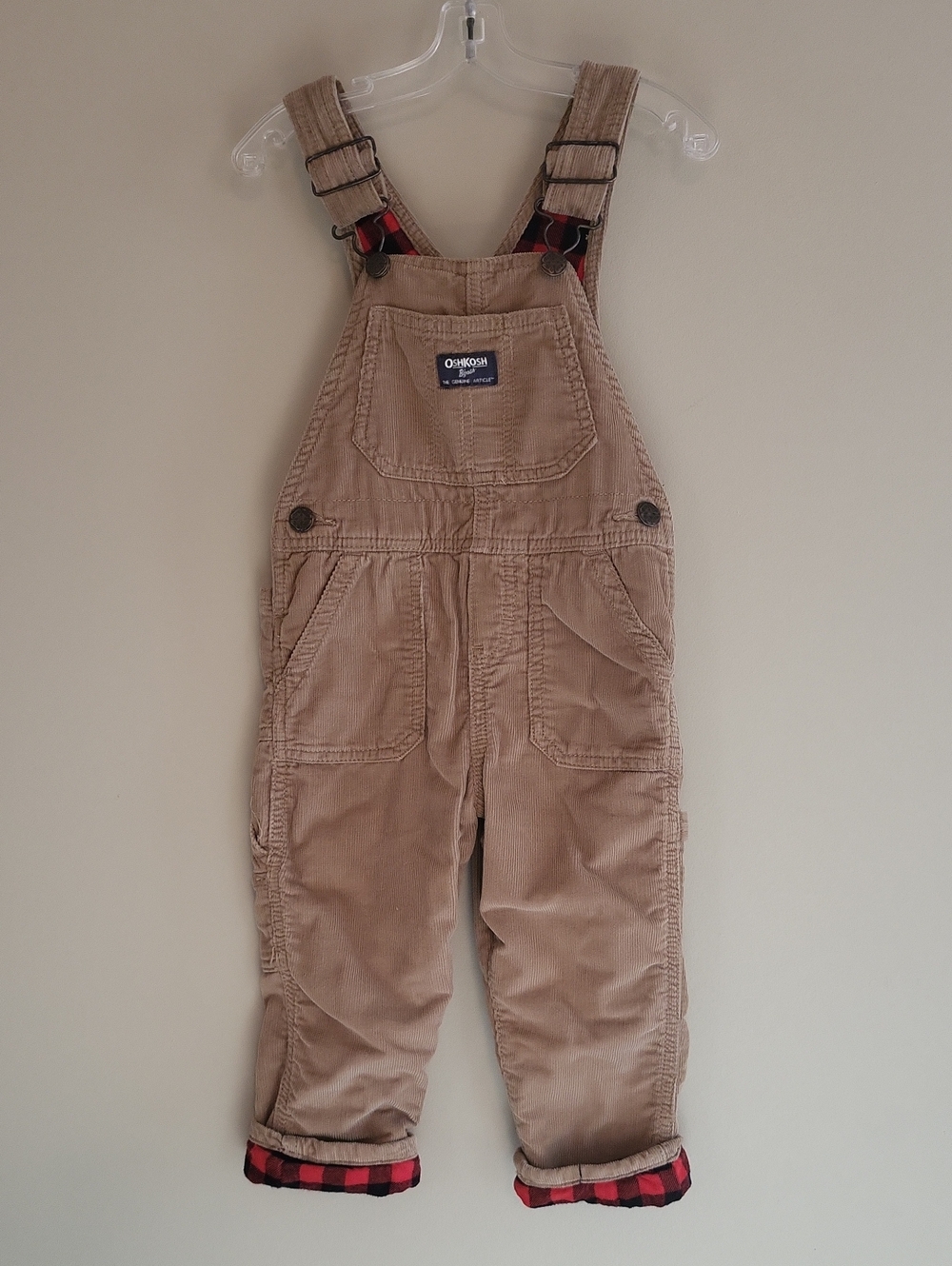 OshKosh B'gosh tan corduroy overalls with red plaid lining